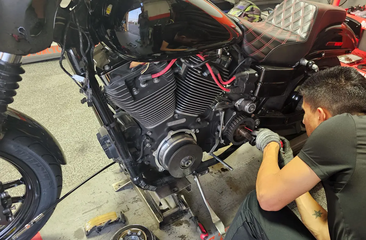 Harley-Davidson mechanic performing engine repair at Motorcycle Tire Center in Orange, CA